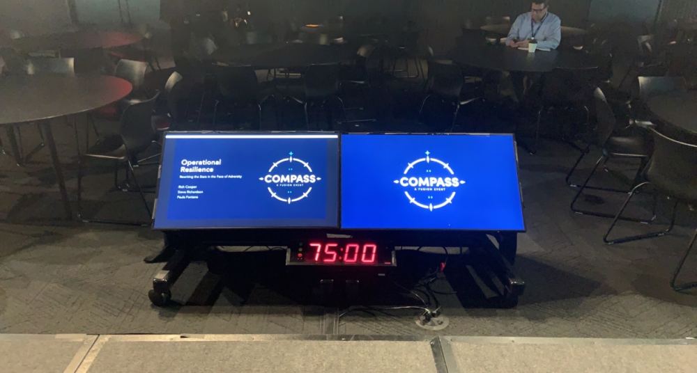 Session countdown clock and Compass title slide before a talk